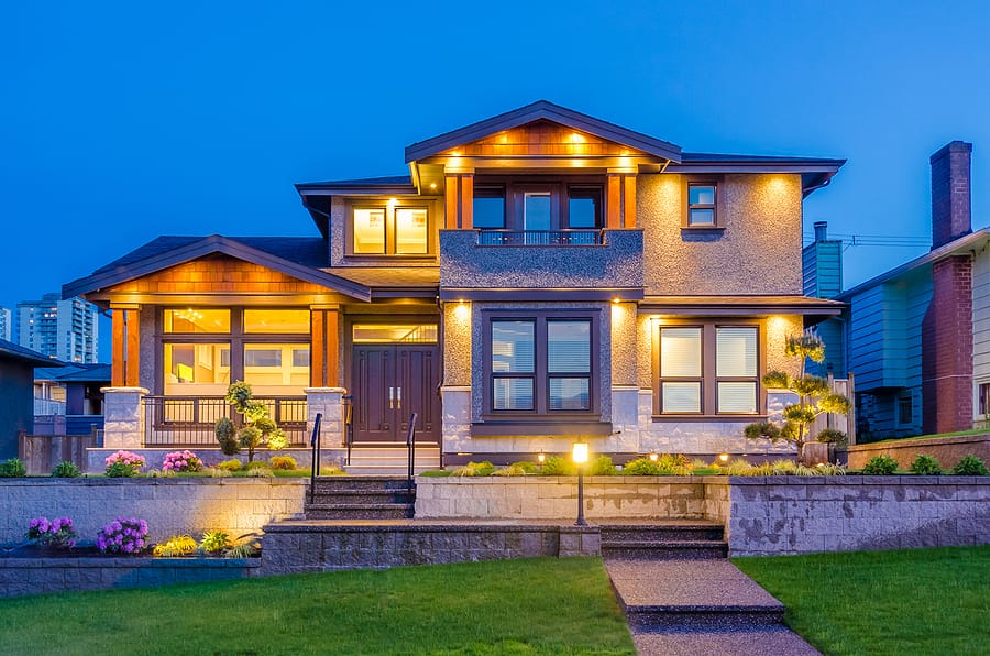 Home and outdoor living space lit in the evening
